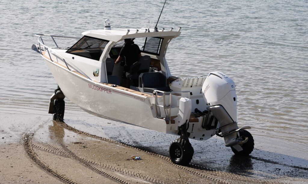Flyfin 750HTA driving into the water from the beach